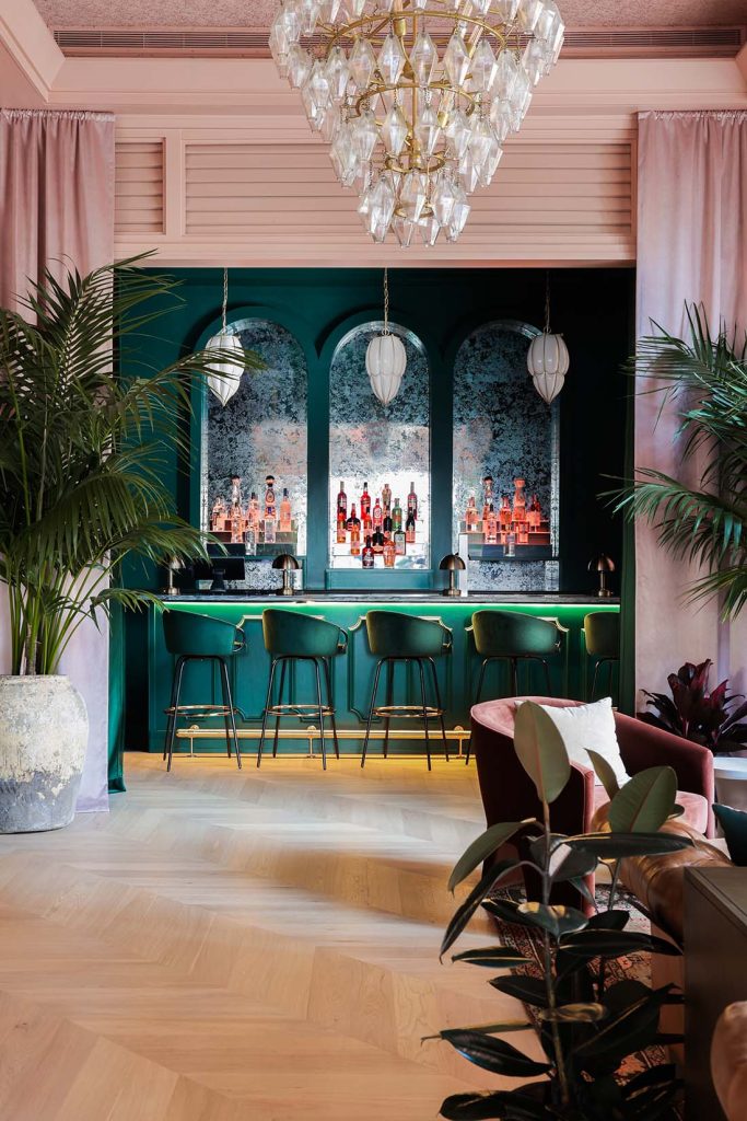 Mirrored wallpaper behind bar at Estelle's