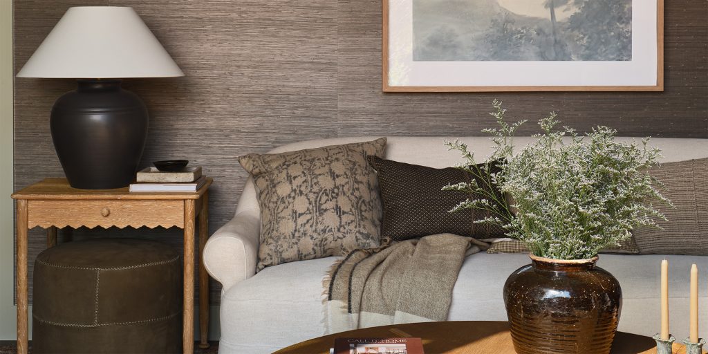 Close-up of "Juicy Jute" grasscloth in secondary living area, designed by Amber Lewis.