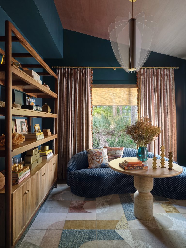 Phillip Jeffries' "Mirage Sunbaked" wallpaper on ceiling in secondary living area designed by Amber Guyton