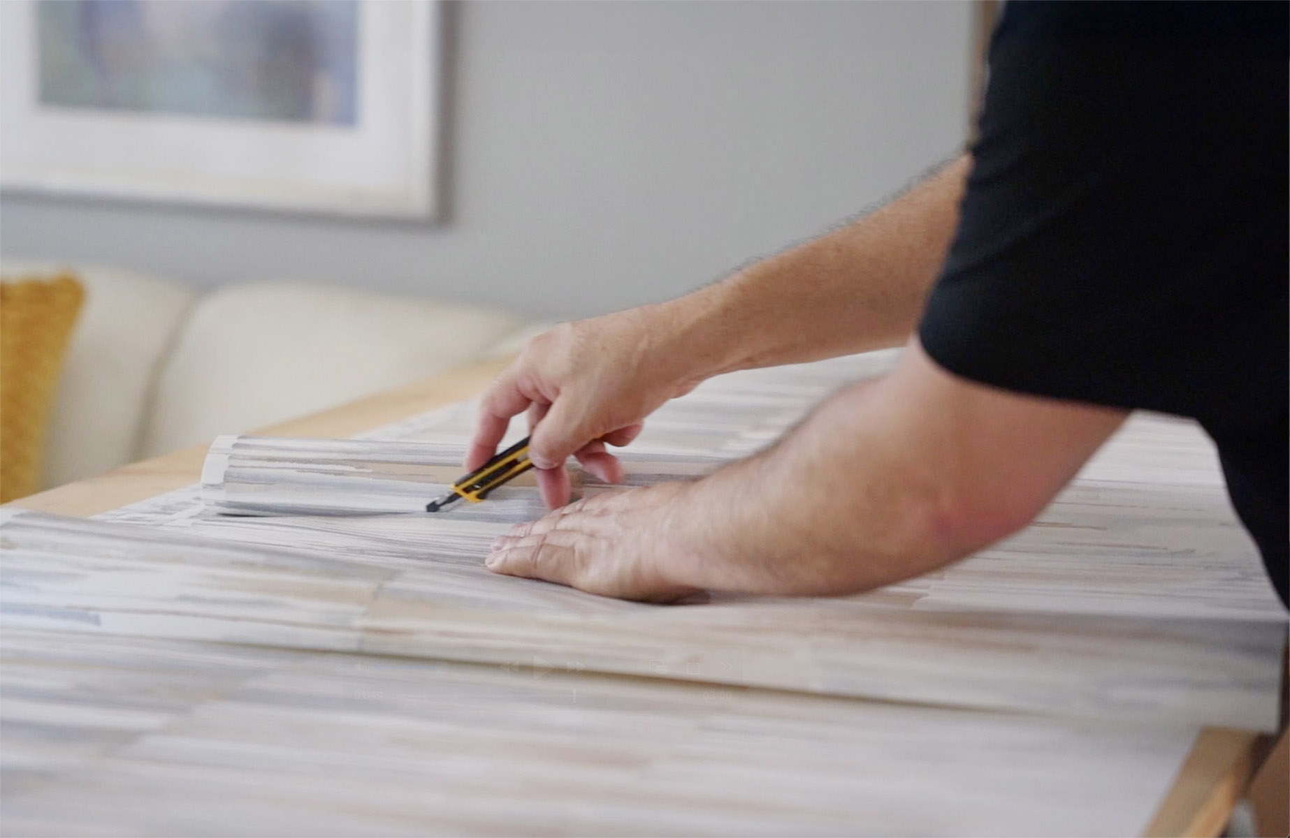 wallpaper-hanger-trimming-wallpaper-roll-paper-moon-wallpaper-specialists-austin-tx