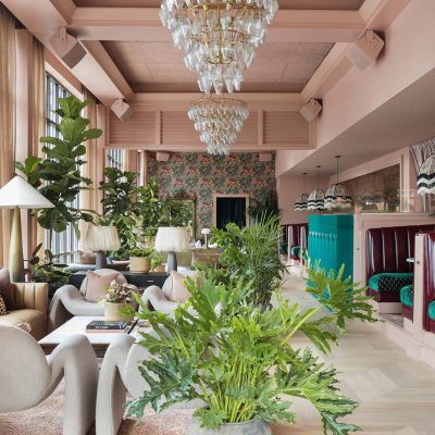 lounge-area-with-wallpaper-on-back-wall-at-estelles-austin-tx-paper-moon-wallpaper-specialists